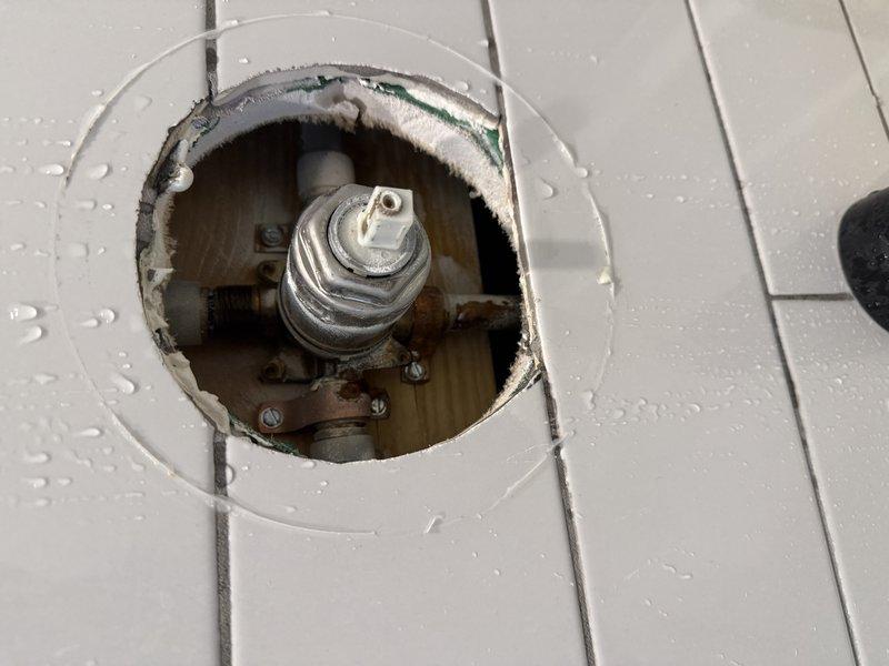 Inspected shower valve system accessed through master bedroom closet. Confirmed valve leakage and source of water intrusion. Provided estimate for replacement of existing valve with customer-supplied chrome fixture.