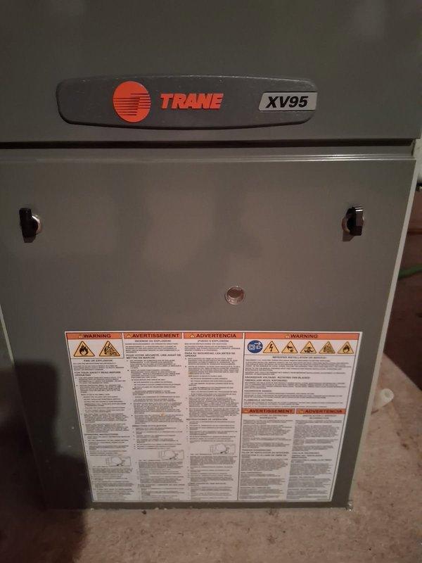 Responded to no heat service call for a 16-year-old Trane XV95 forced air furnace system. Diagnostic inspection revealed unit was blowing cold air due to a cracked heat exchanger and failed igniter. Recommended replacement options to customer and referred to comfort advisor for system upgrade consultation.