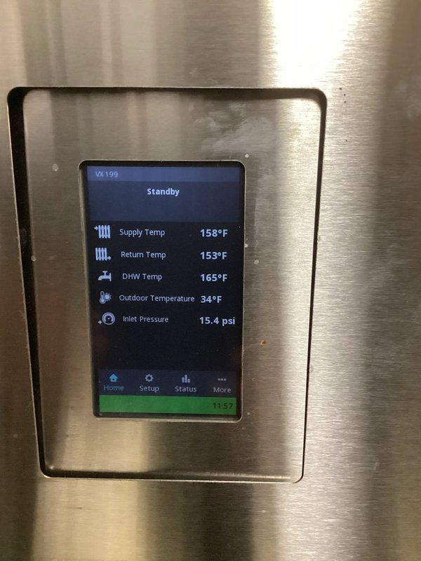 Performed comprehensive tune-up on high efficiency boiler system with indirect tank. Conducted operational inspection including pumps, zone valves, combustion air, and heat exchanger. Cleaned ignitor and increased tank temperature for improved water temperature maintenance. Diagnostic testing confirmed proper operation with supply temperature at 158°F, return at 153°F, and combustion analysis showing CO2 at 9.4% with 87.0% efficiency.