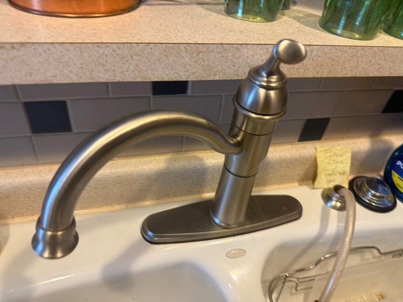 Replaced non-functional kitchen faucet with new American Standard single-handle model featuring modern design and functional sprayer. Also inspected toilet for potential issues as requested by customer. Both fixtures now operating properly with no leaks.