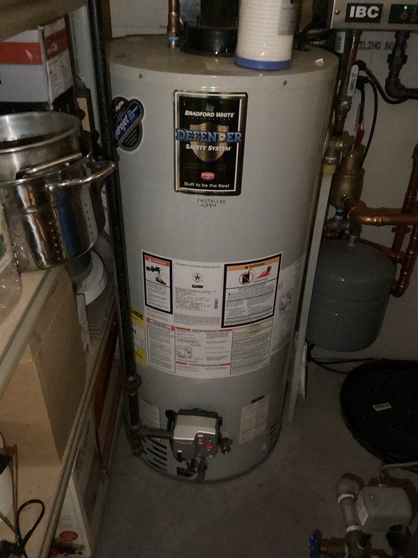 Performed comprehensive tune-up on boiler and forced air furnace systems. Cleaned routine components, conducted thorough inspection of heat exchangers, and tested operational performance. Both units are functioning properly with no immediate concerns identified. Bradford White Defender water heater inspection revealed some corrosion and possible moisture issues at metal joint that should be monitored.