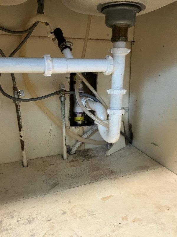 Responded to customer report of a leaking exposed pipe in the basement. Diagnosed and confirmed kitchen drain line with a rusted T-junction. Replaced the damaged section with new PVC P-trap assembly, including elbow joints and unions, ensuring proper connections to existing metal drain component. Work successfully resolved the leak issue.