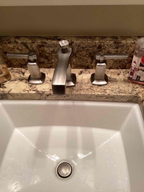 Performed faucet rebuild service with manufacturer replacement cartridge for standard brand bathroom fixtures. Successfully completed the repair on both the shower control system with dual lever handles and the three-piece bathroom sink faucet per the approved estimate. All components were tested for proper function and leak-free operation after installation.
