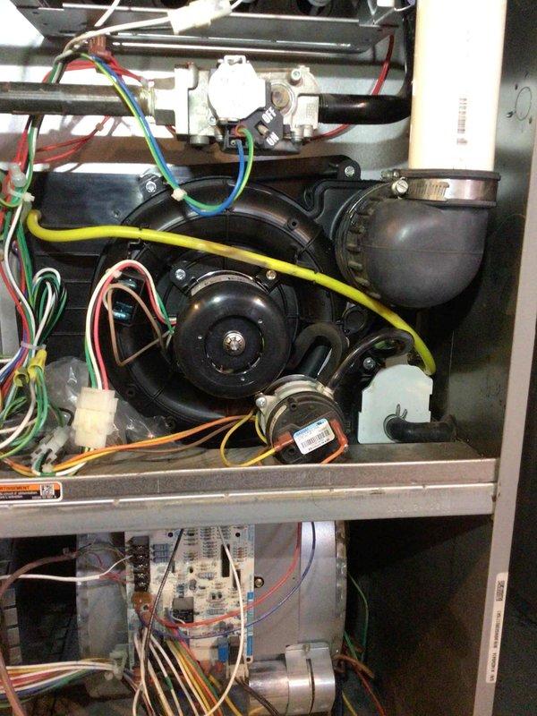 Responded to service call to replace faulty combustion components. Successfully removed and installed new draft combustion inducer assembly and multiple main burners. After installation, system was fully tested and confirmed to be operating properly. Customer was already aware of unrelated plumbing issue (bathroom pipe dripping above furnace).