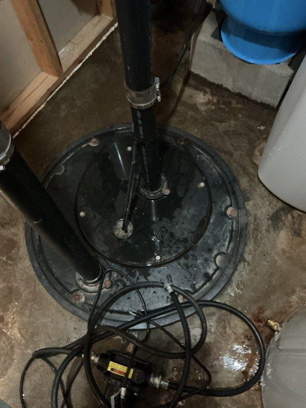 Responded to emergency service call for basement flooding in furnace room. Diagnosed failed grinder pump as source of water leakage affecting toilet and shower areas. Installed replacement grinder pump, new toilet, and new toilet shut-off valve to resolve flooding issue. System tested and confirmed operational with proper drainage restored.