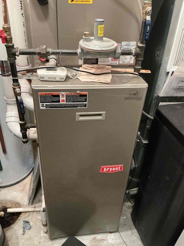 Responded to service call for Bryant furnace with no heat. Diagnosed multiple issues: plugged filter from ultrasonic humidifier, faulty limit switch, and malfunctioning Honeywell thermostat. Replaced air filter with customer-provided filter, installed new thermostat, and advised customer to discontinue use of ultrasonic humidifier. System now operating properly.