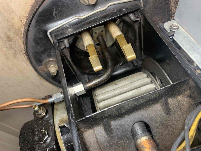 Responded to customer concerns regarding CO2 and smoke from furnace making intermittent rumbling noises. Performed comprehensive inspection of furnace system including visual examination of heat exchanger, electrodes and nozzle. Reconnected flue stack and sealed the chimney connection point to ensure proper venting. Verified ignition system functioning correctly with no delays in ignition sequence.