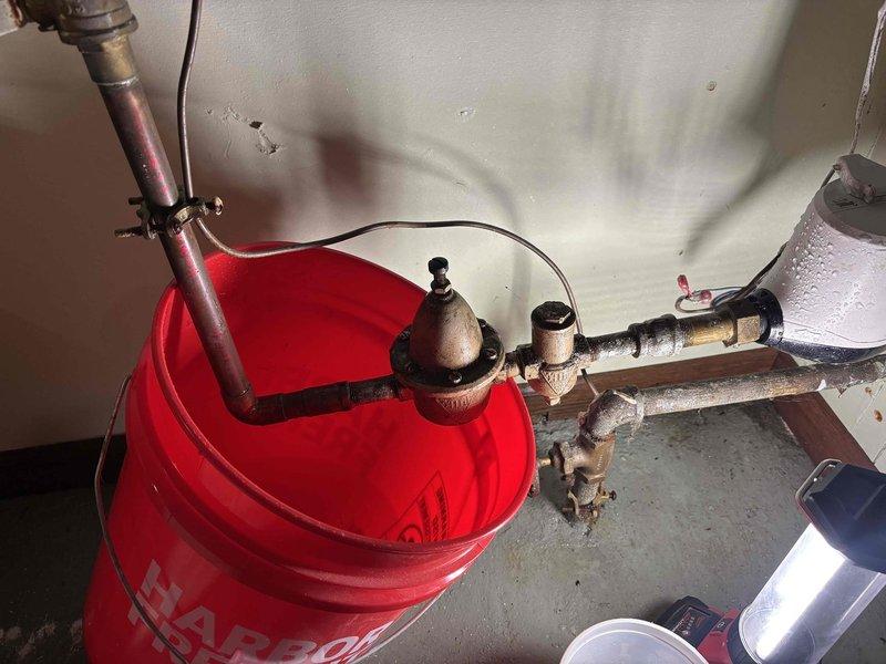 Responded to basement flooding caused by failed pressure relief valve (PRV). Diagnosed severely corroded internal components, removed defective PRV, and hard-piped connection to restore water service. Provided estimate for permanent PRV replacement and installation of leak detection shut-off valve downstream from water meter.