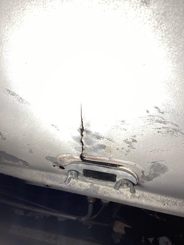 Responded to no-heat service call for 15-year-old Empire heater. Diagnosed severely plugged heat exchanger with significant cracking on front plate, visible in multiple locations. Unit deemed beyond repair due to compromised heat exchanger integrity. Scheduled consultation for replacement unit.