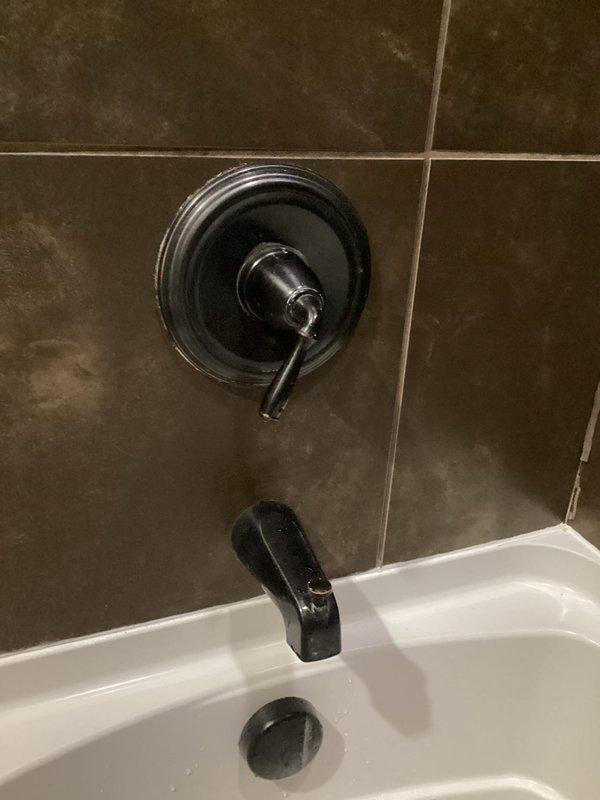 Diagnosed a faulty Delta shower cartridge in upstairs bathroom preventing hot water flow. Upon inspection, determined entire valve requires replacement rather than simple cartridge change. Special ordered new oil bronze shower valve to match existing bathroom fixtures and address the water temperature control issue.