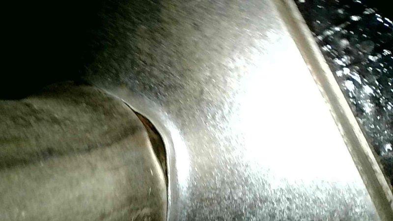 Responded to no-heat service call for LP furnace with non-functioning Nest thermostat. Found tripped rollout switch and heavily rusted burners causing flame irregularities. Reset switch, removed and cleaned burners, verified heat exchanger integrity, and installed new thermostat. Advised customer on future burner replacement due to extensive rust.