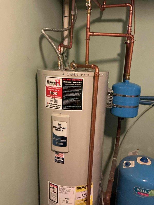 Replaced 16-year-old Bradford White electric water heater due to a faulty lower heating element causing inefficient heating with only 4-5 minutes of hot water. New unit installed with proper connections to existing copper plumbing system and expansion tanks, restoring full hot water capacity to the home.