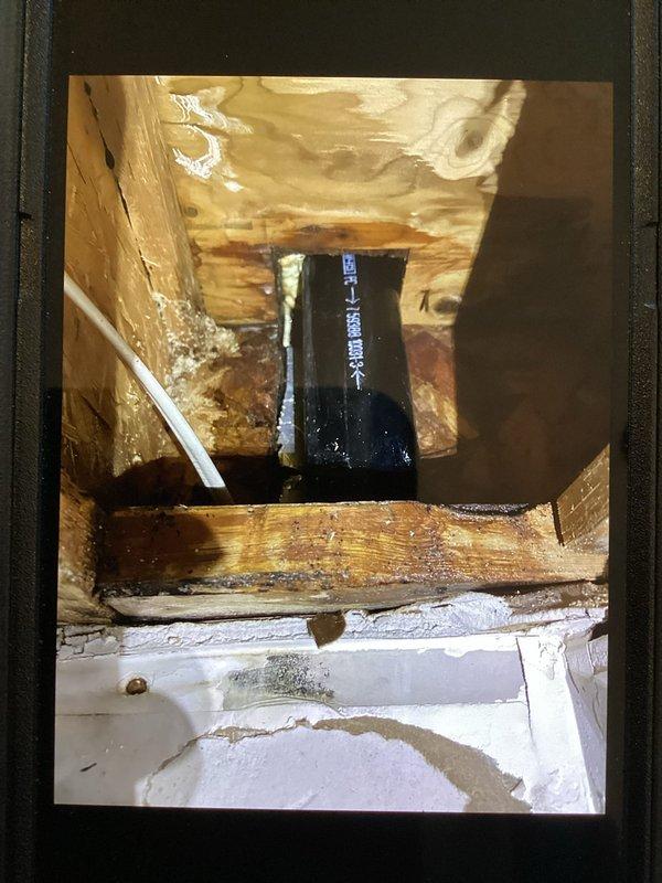 Investigated and repaired a kitchen drain pipe leak that was affecting the basement area. Upon inspection, discovered significant water damage to wooden structural components behind a built-in oven cabinet which homeowner had prepared for access. Identified the leak source in the drain line that activates when kitchen sink and upstairs bathroom fixtures are used, and completed necessary repairs to resolve the issue.