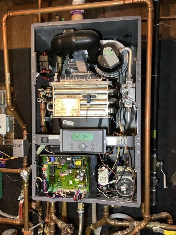 Investigated boiler system with leaking pressure relief valve and no heat. Discovered improper installation of customer-added expansion tank, causing water to flow directly from supply through relief valve when unit activated. Identified compromised auto fill valve as primary issue. Ordered replacement parts including auto fill valve, backflow preventer, and pressure relief valve for repair.