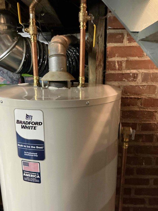 Successfully completed the installation of a Bradford White 50-gallon natural gas standard vent water heater as a replacement for a malfunctioning 40-gallon unit. All connections were properly fitted with appropriate copper piping and brass valves, and the venting system was correctly installed according to code requirements.
