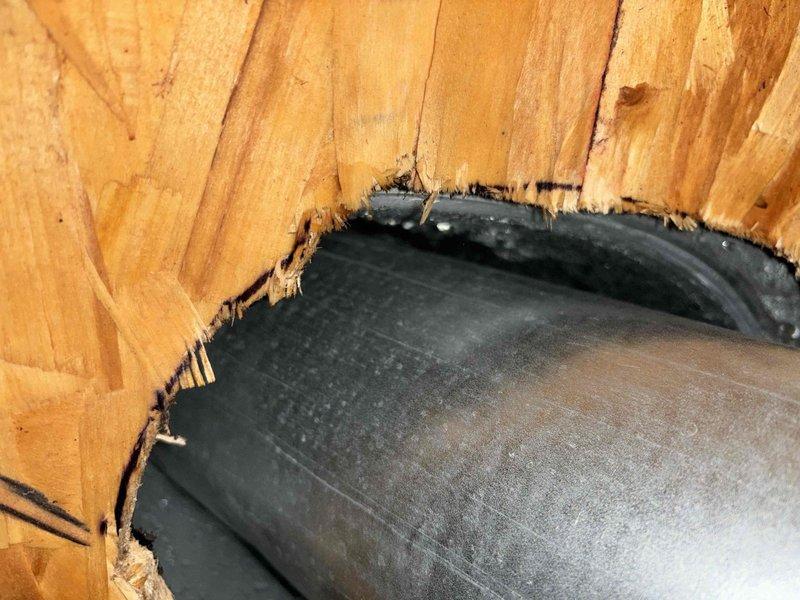 Responded to customer complaint of water accumulation beneath garage furnace exhaust vent. Inspection revealed moisture intrusion from roof penetration point, with visible water damage around exhaust pipe flashing. Temporary assessment completed; recommended follow-up service in spring to properly reseal roof flashing and conduct thorough attic inspection when conditions permit dry access.