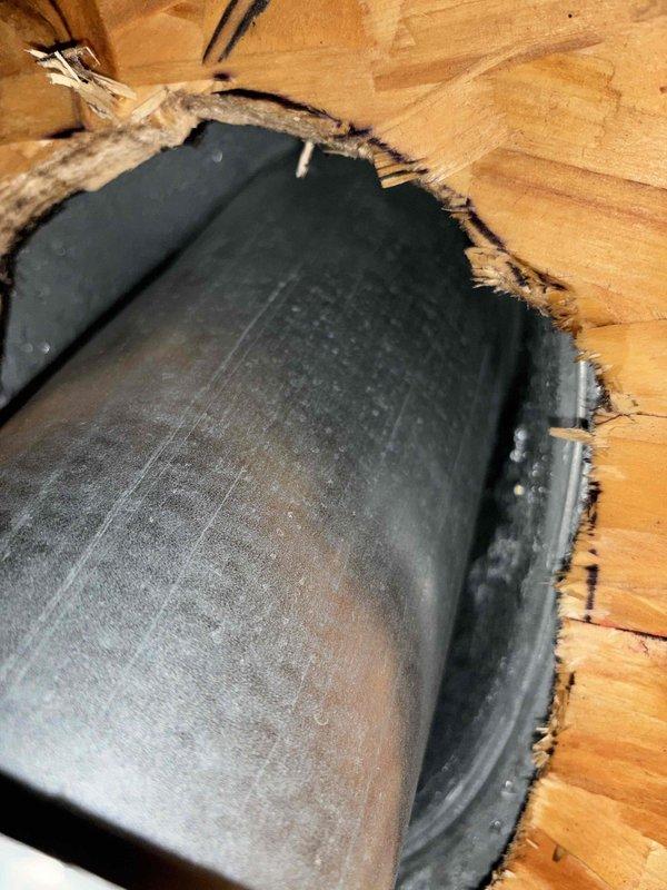 Responded to customer complaint of water accumulation beneath garage furnace exhaust vent. Inspection revealed moisture intrusion from roof penetration point, with visible water damage around exhaust pipe flashing. Temporary assessment completed; recommended follow-up service in spring to properly reseal roof flashing and conduct thorough attic inspection when conditions permit dry access.