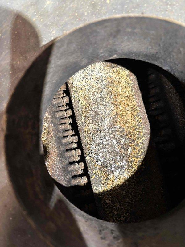 Responded to carbon monoxide alarm issue caused by backdrafting of 20-year-old gas boiler. Inspected venting system and chimney, finding possible restriction at flu cap with icicle formation. Determined unit operates effectively with additional combustion air. Recommended chimney specialist evaluation, potential flu liner installation, and future consideration of replacing aging unit with a condensing boiler.