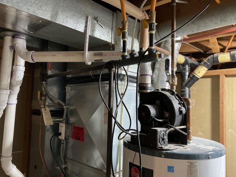 Diagnosed a 2010 natural gas powervent water heater with no hot water production. Inspection revealed gas valve/ignition problems as evidenced by the digital display on control panel showing flame pattern irregularities. Due to the unit's age (approximately 11-12 years old) and the nature of the ignition system failure, recommended full water heater replacement as repairs would not be cost-effective or reliable for long-term operation.