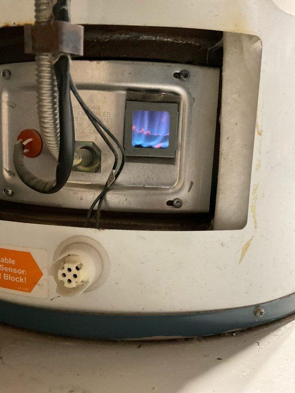 Diagnosed a 2010 natural gas powervent water heater with no hot water production. Inspection revealed gas valve/ignition problems as evidenced by the digital display on control panel showing flame pattern irregularities. Due to the unit's age (approximately 11-12 years old) and the nature of the ignition system failure, recommended full water heater replacement as repairs would not be cost-effective or reliable for long-term operation.