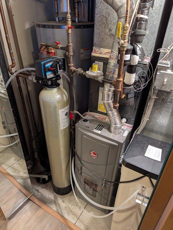 Responded to service call for tanked water heater with no hot water. Diagnosed faulty pilot assembly as the issue, as pilot would light during reset but would not remain lit. Inspected Rheem water heater system and surrounding components. Provided customer with options for repair or replacement of the unit.