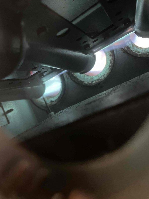 Responded to service call for furnace error code complaint. Diagnostics revealed no stored error codes on control board but identified rotted burners causing ignition problems, evidenced by visible corrosion around burner openings. Performed system reset to clear thermostat error message. Customer approved replacement of deteriorated burners; completed part order form for new components.
