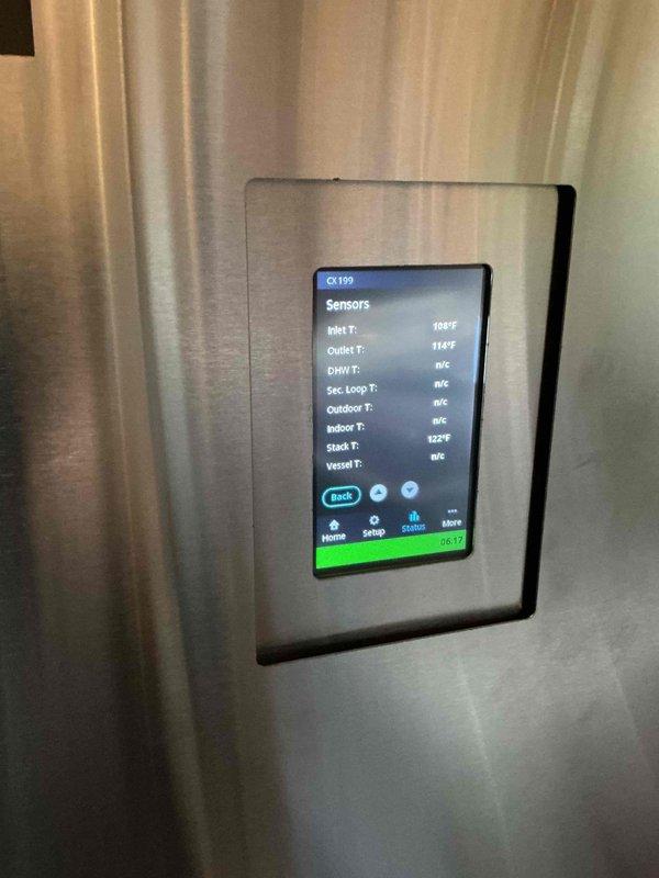 Responded to service call for IBC boiler CK199 reporting high vent limit error code and no hot water. Inspected venting system which showed proper condition, slope and clear termination. Diagnostic testing included running hot water for extended period while monitoring stack temperature, which remained below 127°F. Verified proper operation of exhaust temperature sensor, condensate drainage system, and central heating functionality. No current operational issues detected; likely caused by heavy hot water demand. Instructed customer on proper boiler reset procedure.