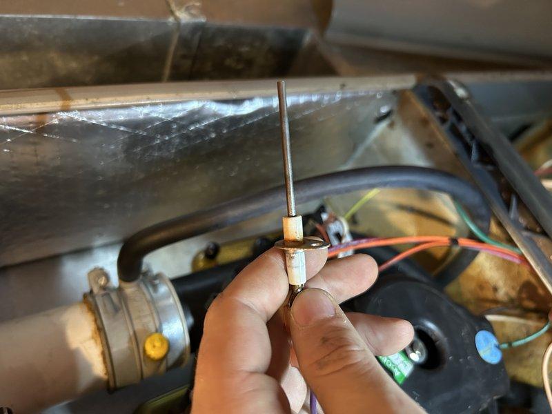 Performed annual furnace maintenance on 16-year-old system. Identified and tightened loose Fernco fitting on exhaust pipe that was causing water leakage. Found water leaking from collector box below inducer motor, which was operating with excessive noise. Cleared condensate drain line and tested system operation. Diagnosed weak blower capacitor (10.0μF 370VAC) requiring replacement. Recommended replacement of inducer motor, collector box, and capacitor. Service advisor scheduled for follow-up.