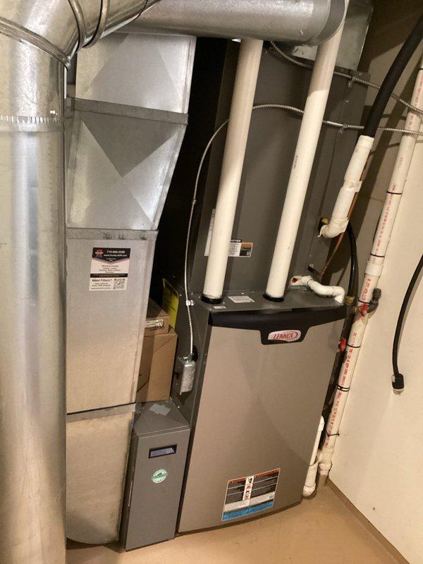 Performed scheduled furnace tune-up on Lennox system, finding all routine electrical components and heat exchanger within specification. Identified water leaking from secondary drain due to incorrect furnace pitch. Completed maintenance including filter inspection, humidifier pad check, flame sensor cleaning, and gas pressure verification. Both main furnace and garage unit were tested with proper operation confirmed at 70 degree temperature rise. Customer informed that office will schedule return visit to correct furnace pitch issue.