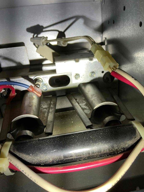 Responded to a no heat call for 25-year-old Amana furnace. Diagnosed tripped limit switch due to restricted airflow from severely clogged filter. Replaced filter and reset system, restoring normal heating operation. Unit functioning properly upon departure.