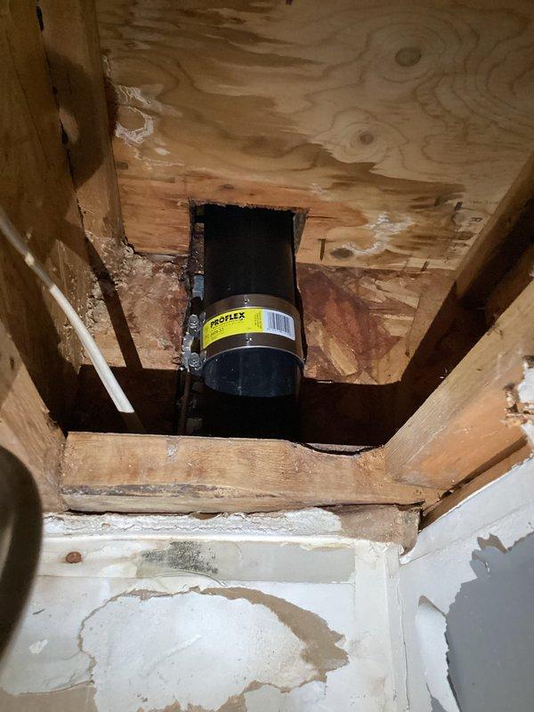 Completed repipe job involving replacement of a leaking sanitary T fitting. Accessed pipe behind wall that had developed a hole causing water damage. Successfully installed new PVC drainage components and Proflex piping through wooden framing structure. Total repair time: 3 hours.