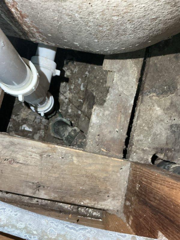 Responded to service call for a clogged bathroom tub drain. Upon inspection, accessed the crawl space to examine the PVC drain pipes and metal connection points showing signs of corrosion. Successfully cleared the clogged drain line, restoring proper drainage function to the tub.