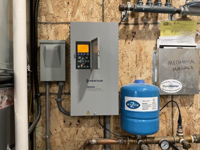 Responded to no-water emergency call. Diagnosed Pentair variable speed well pump control system displaying low amp fault and failure mode. After resetting control unit and testing voltage with same fault recurring, recommended customer contact well repair/drilling specialist for further service.