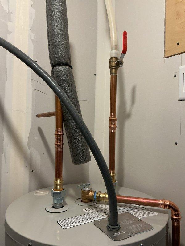 Successfully installed new water heater after diagnosing no hot water condition caused by shorted heating elements due to hard water buildup. Completed full water heater tune-up and installed copper supply lines with appropriate shut-off valves and insulation to ensure proper system function.