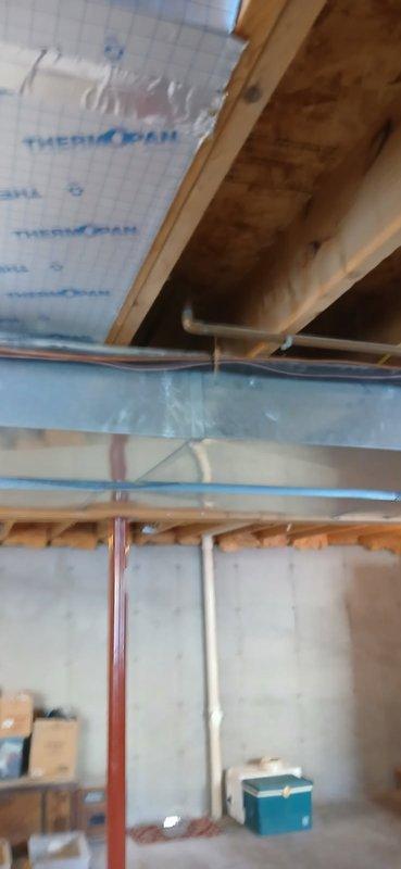 Responded to customer call regarding water leakage from cold air return. Upon inspection, determined issue is plumbing-related rather than HVAC-related. Observed water staining on wooden joists in unfinished basement/attic area. Confirmed with customer that plumber is scheduled to investigate suspected sources (dishwasher or toilet) tomorrow.