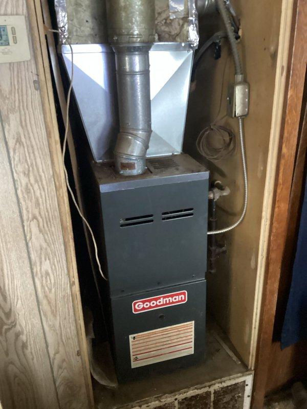 Responded to customer complaint of no heat in Goodman gas furnace. Diagnostic testing confirmed thermostat was operating correctly with 24V signal present at control board and 120V power supply intact. Determined control board failure was preventing furnace ignition sequence, with no indicator lights displayed on panel. This was the second board failure incident for this unit within a year. Customer opted for system replacement rather than repeat repair, with installation scheduled for a later date.