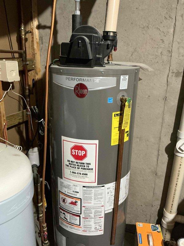 Performed routine furnace tune-up on 20+ year old natural gas unit. Inspected Rheem Performance water heater and Aprilaire humidity control system, which was functioning properly with indicator light on automatic mode. Noted furnace is experiencing longer-than-normal run cycles due to worn components; provided repair options to homeowner.