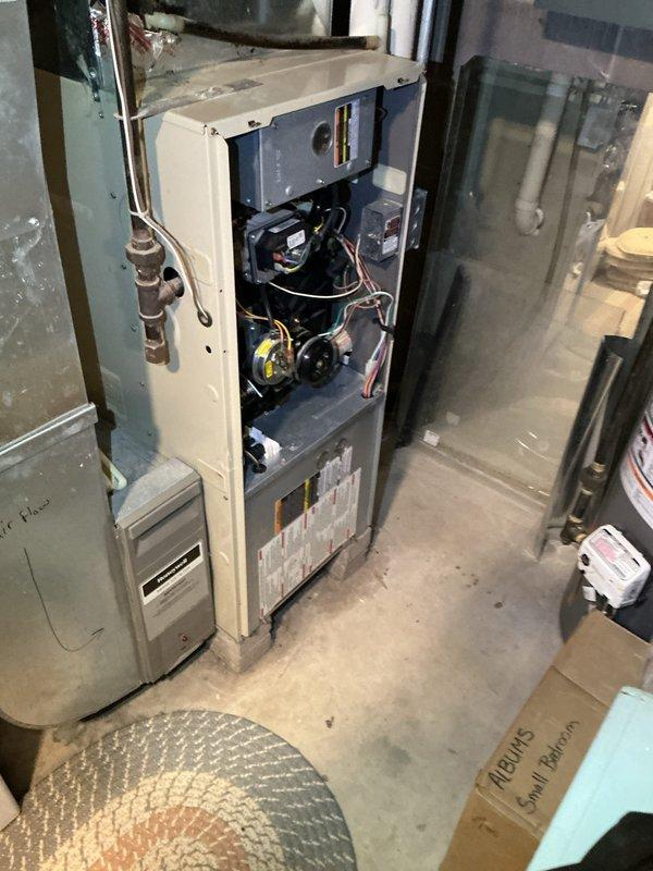 Diagnosed 24-year-old Bryant natural gas furnace blowing cold air due to failed igniter. Multimeter testing confirmed igniter failure. Replaced igniter, restoring proper heat function. System inspection showed secondary heat exchanger remains operational at this time. Discussed equipment age and replacement options with homeowner.