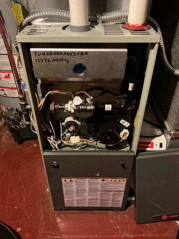 Conducted standard maintenance inspection on 12-year-old Trane furnace (model TUH2D060M3V3BA). System components including igniter, flame sensor, gas valve, control board, draft motor, blower motor, and blower wheel were evaluated and found to be in satisfactory condition. Discovered two significant cracks in the heat exchanger, requiring immediate safety shutdown of the system. Due to safety concerns, customer opted for consultation regarding replacement options.