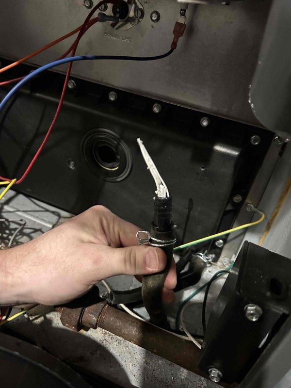 Responded to no heat service call on a 2-year-old Goodman system. Upon arrival, observed furnace was cycling off due to pressure switch issues. Diagnosed water in inducer motor, cleared inducer and drain line to restore proper operation. Noted high supply temperature and advised customer to open closed basement vents to improve system efficiency and airflow.