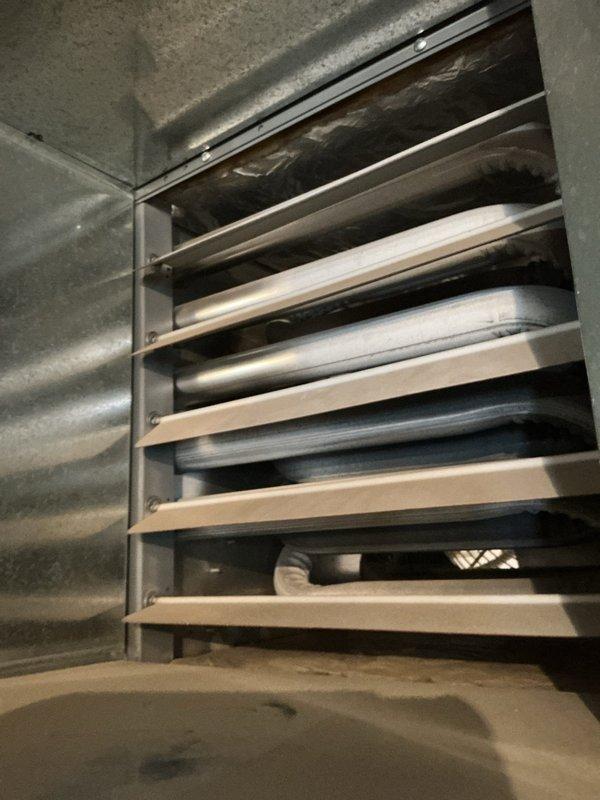 Responded to customer report of no heat from Sterling RF-75 gas garage heater. Diagnosed two critical issues: loose R wire connection at thermostat and flame rollout from compromised heat exchanger. Due to safety concerns with the flame rollout condition and visible damage to heat exchanger components, recommended and completed full replacement of the garage heating unit to restore safe heating functionality.