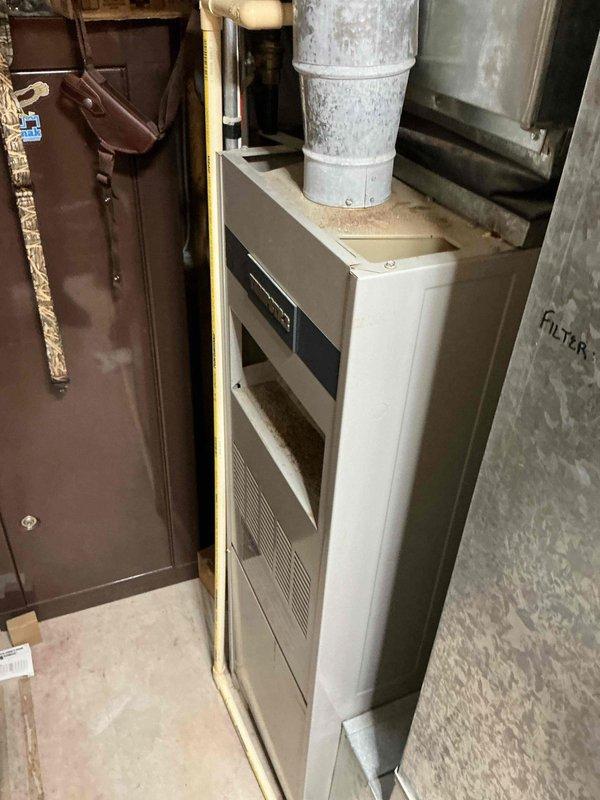 Diagnosed and serviced 34-year-old Tempstar furnace that was failing to maintain heat. Inspection revealed the control board was shorting out, causing interruption of the gas valve operation and preventing the pilot light from staying lit. Replaced failed ignition control board to restore proper system operation.