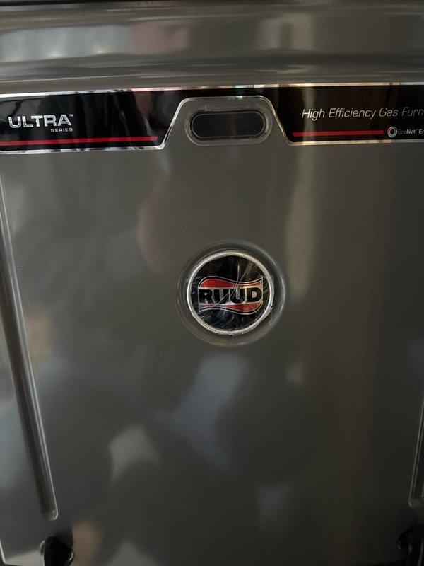 Responded to no-heat service call for 10-year-old Ruud ULTRA Series high efficiency gas furnace displaying error code 45. Diagnostic testing revealed low stage pressure switch failure with 1.9" WC measured against required 0.30" WC. Replaced defective pressure switch with universal component, performed complete system inspection including heat exchanger evaluation, and restored normal operation. Visual inspection noted some internal component deterioration and corrosion consistent with unit age.