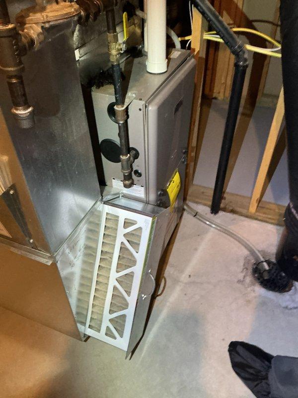 Completed furnace maintenance on a 13-year-old unit (2012 model, installed 2014). Inspected system and found it running properly with no operational issues. Replaced heavily clogged air filter with a new Purolator filter to restore proper airflow. System is functioning correctly after service.