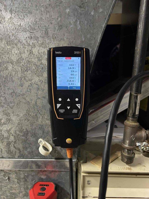 Performed annual furnace tune-up on 9-year-old unit that had previous ignitor issues. Cleaned heavily contaminated air filter and flame sensor, which were causing operational problems. Conducted combustion analysis with Testo 310 II analyzer to verify proper functioning. Unit now operating within normal parameters.