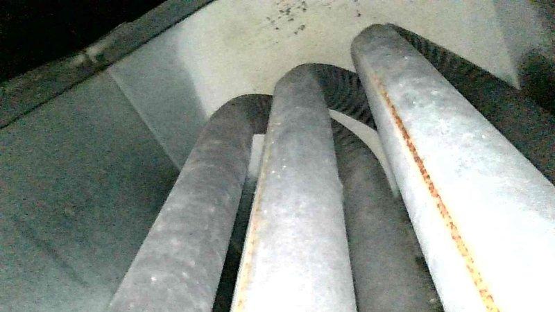 Performed comprehensive furnace inspection on 15-year-old unit running at reduced efficiency (88.4% vs rated 92%). Identified heat exchanger showing stress with possible pinhole deterioration and inducer motor bearings exhibiting wear. Inspected Aprilaire humidifier system and documented condition. Discussed aging equipment concerns with homeowner for future consideration.