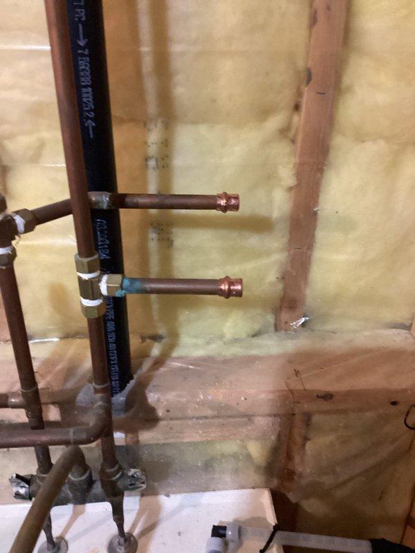 Successfully capped water supply lines to abandoned wet bar. Accessed plumbing through wall cavity, removed existing copper supply lines, and installed appropriate brass caps to terminate service while maintaining system integrity.