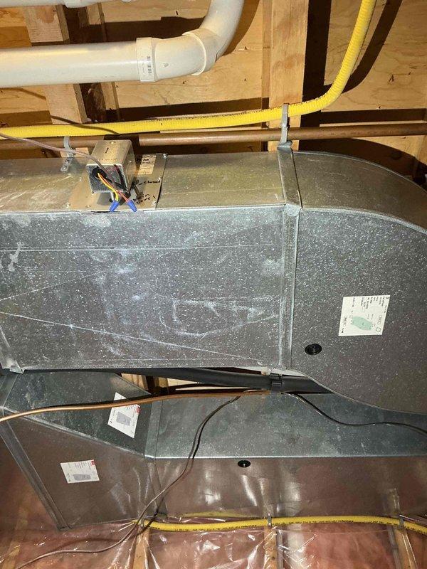 Responded to customer complaint of odor in basement bedroom suspected to be coming from recently replaced furnace/AC units. Upon inspection, determined the smell is not originating from HVAC system. Observed normal operation of furnace with no unusual conditions that would produce odors. Documented frost buildup on evaporator coil which will require separate maintenance but is unrelated to reported smell. Advised customer the odor issue is likely due to moisture infiltration or pest activity requiring different professional services.