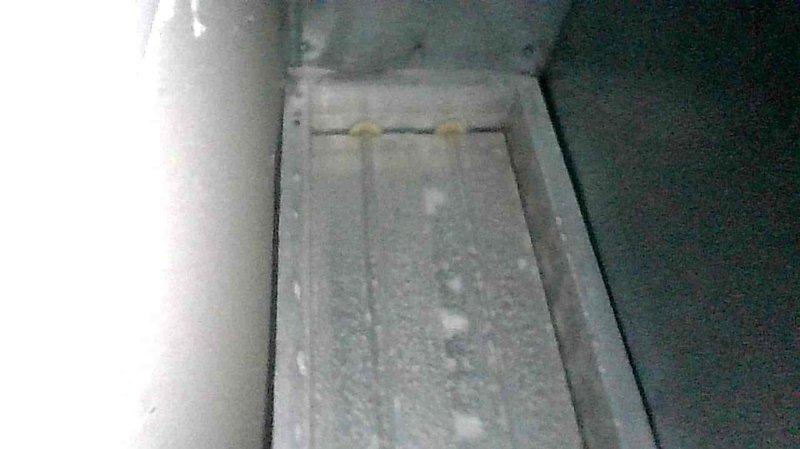 Responded to customer complaint of odor in basement bedroom suspected to be coming from recently replaced furnace/AC units. Upon inspection, determined the smell is not originating from HVAC system. Observed normal operation of furnace with no unusual conditions that would produce odors. Documented frost buildup on evaporator coil which will require separate maintenance but is unrelated to reported smell. Advised customer the odor issue is likely due to moisture infiltration or pest activity requiring different professional services.