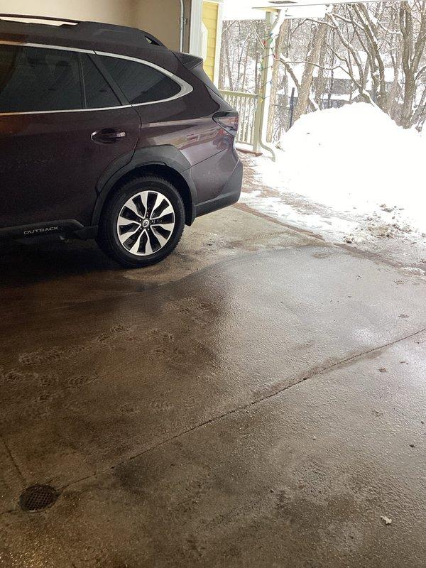 Responded to service call for clogged floor drain in garage area. Upon inspection, identified water backing up around drain area with evidence of moisture damage to basement ceiling below. Determined discharge line was frozen due to winter conditions. Client referred to professional with jetting equipment for proper clearing of the obstruction.